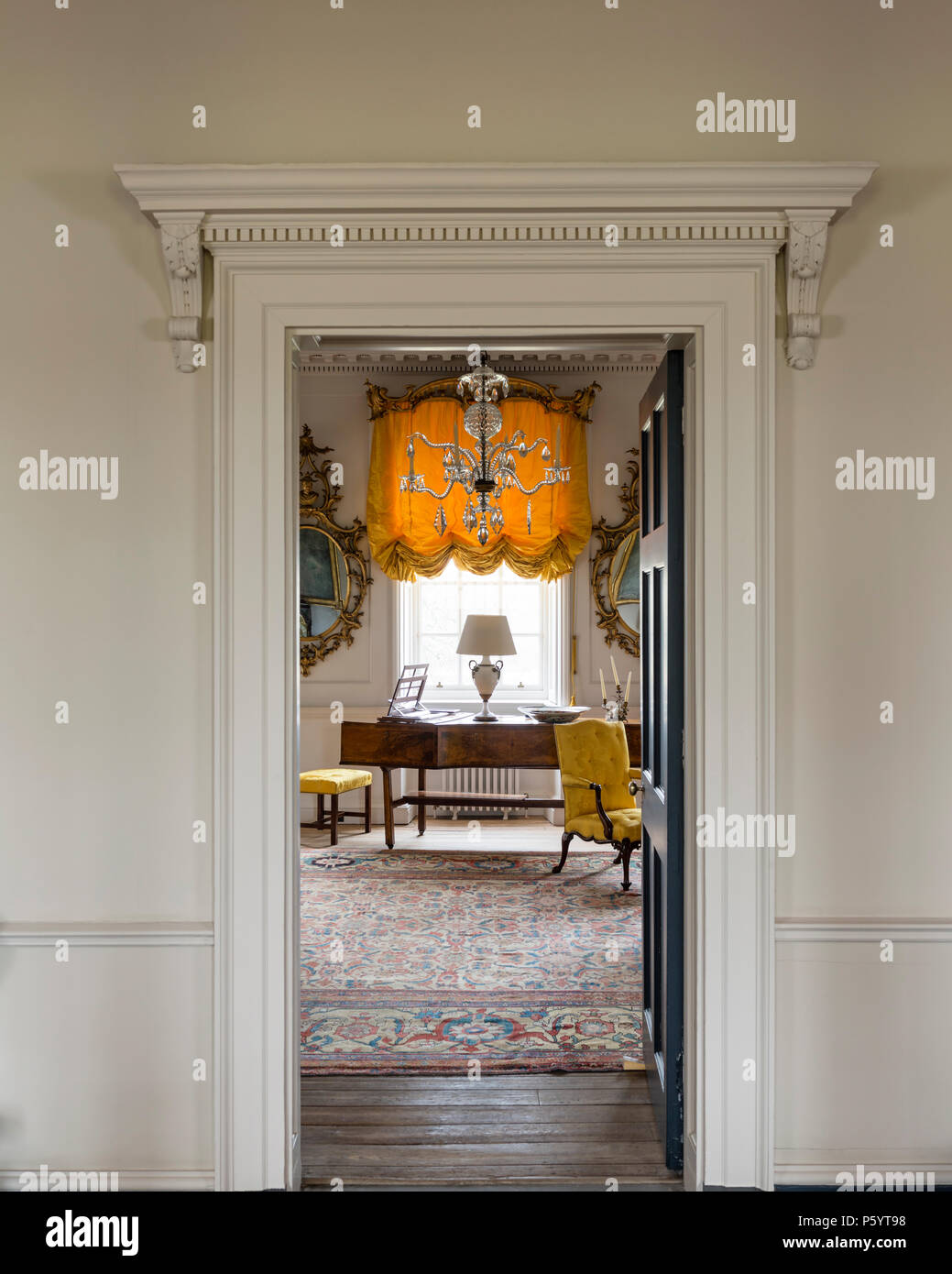 Open door to luxurious room with piano Stock Photo