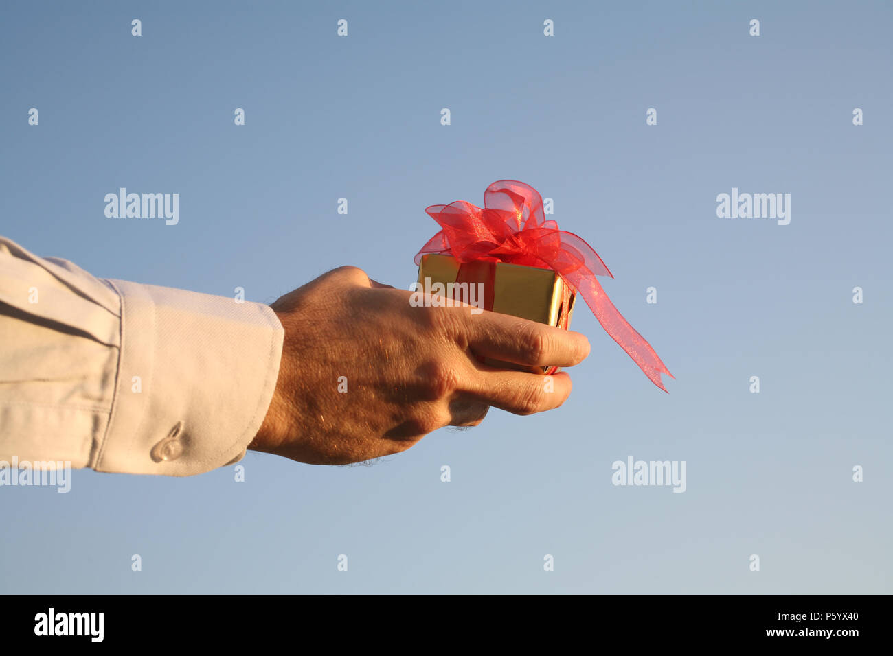 Man Giving Box Hand giving box gift box hi-res stock photography and images - Alamy