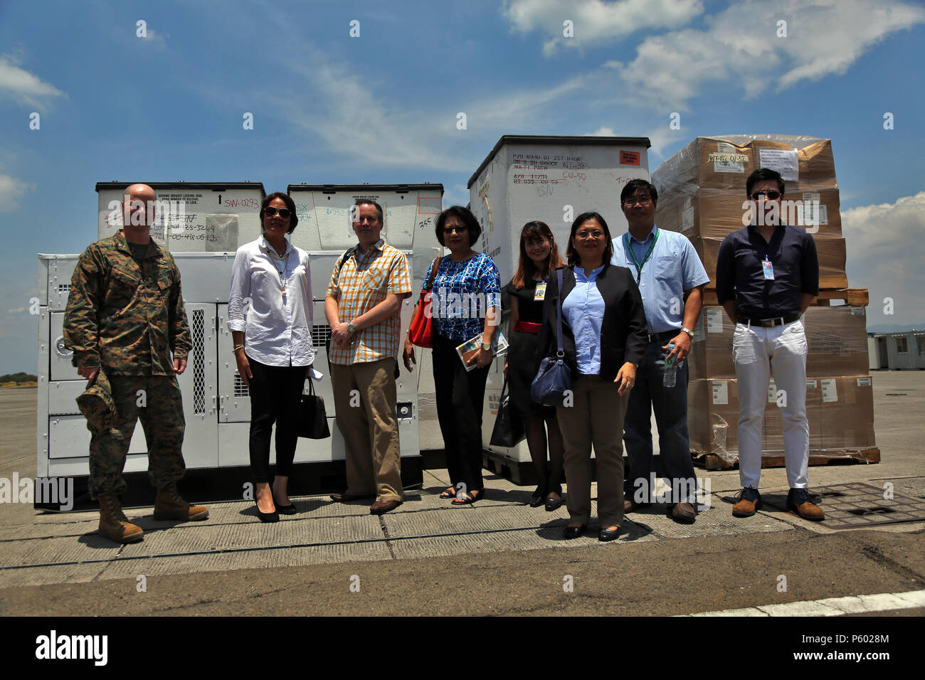 Members from the Philippine Department of Health, USAID and U.S. Navy pose for a photograph during a turnover of humanitarian assistance equipment during exercise Balikatan in Subic, Philippines April 6, 2016. The exercise provided an opportunity to deliver the equipment on U.S. Naval Ships to the Philippines. Balikatan, which means 'shoulder to shoulder' in Filipino, is an annual bilateral training exercise focused on improving the ability of Philippine and U.S. military forces to work together during planning, contingency and humanitarian assistance and disaster relief operations.  (U.S. Mar Stock Photo
