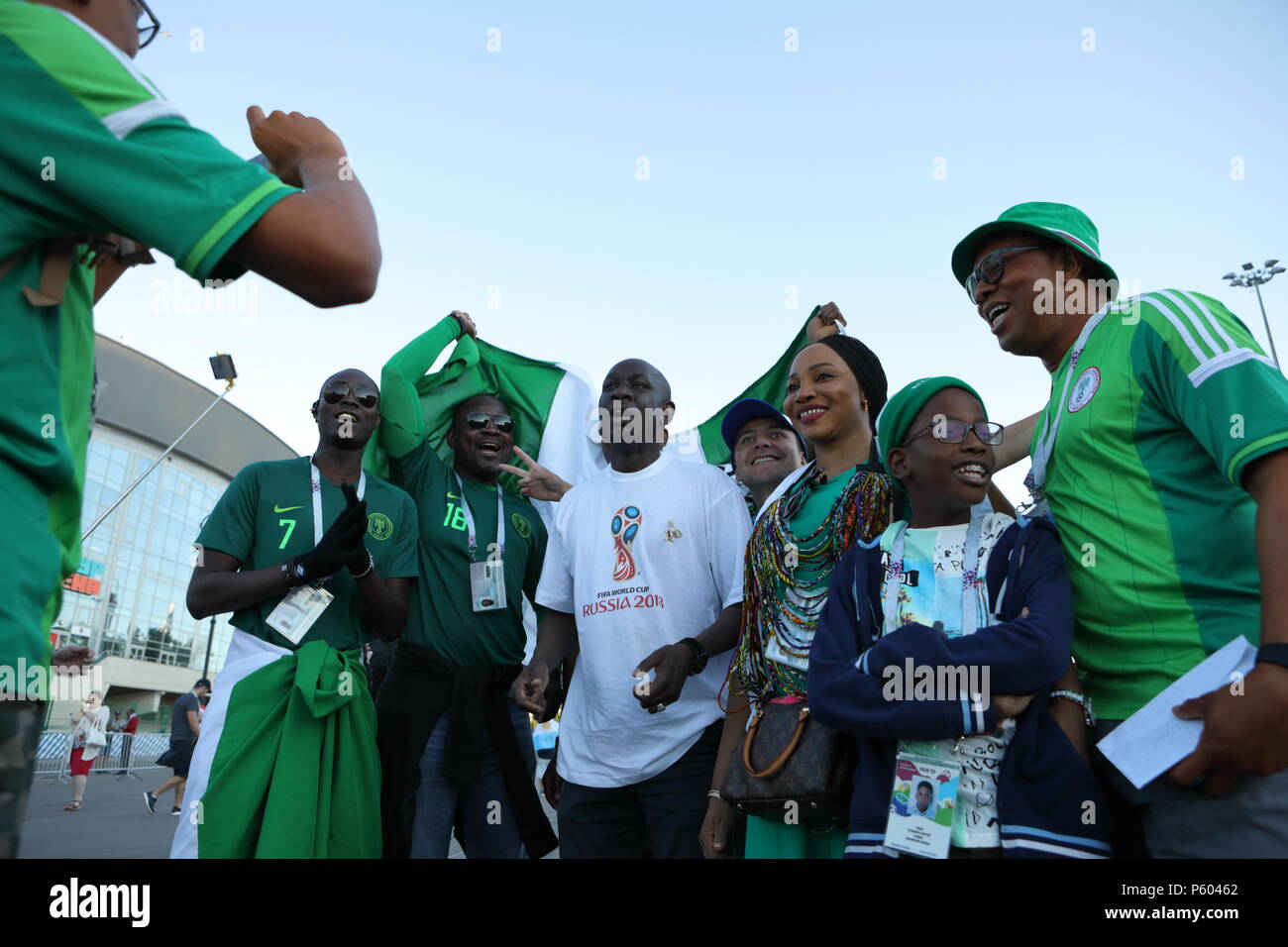 St. Petersburg, Russia - June 26, 2018: Nigerian football fans with national flag going to Saint Petersburg stadium to support their team in the match Stock Photo