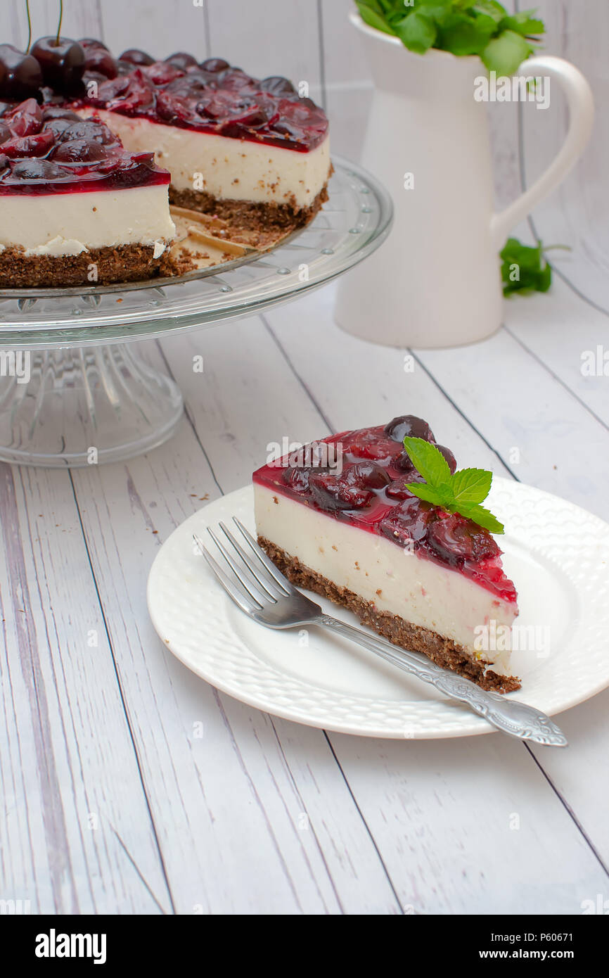 Cold cheesecake with cherry jelly on table Stock Photo Alamy