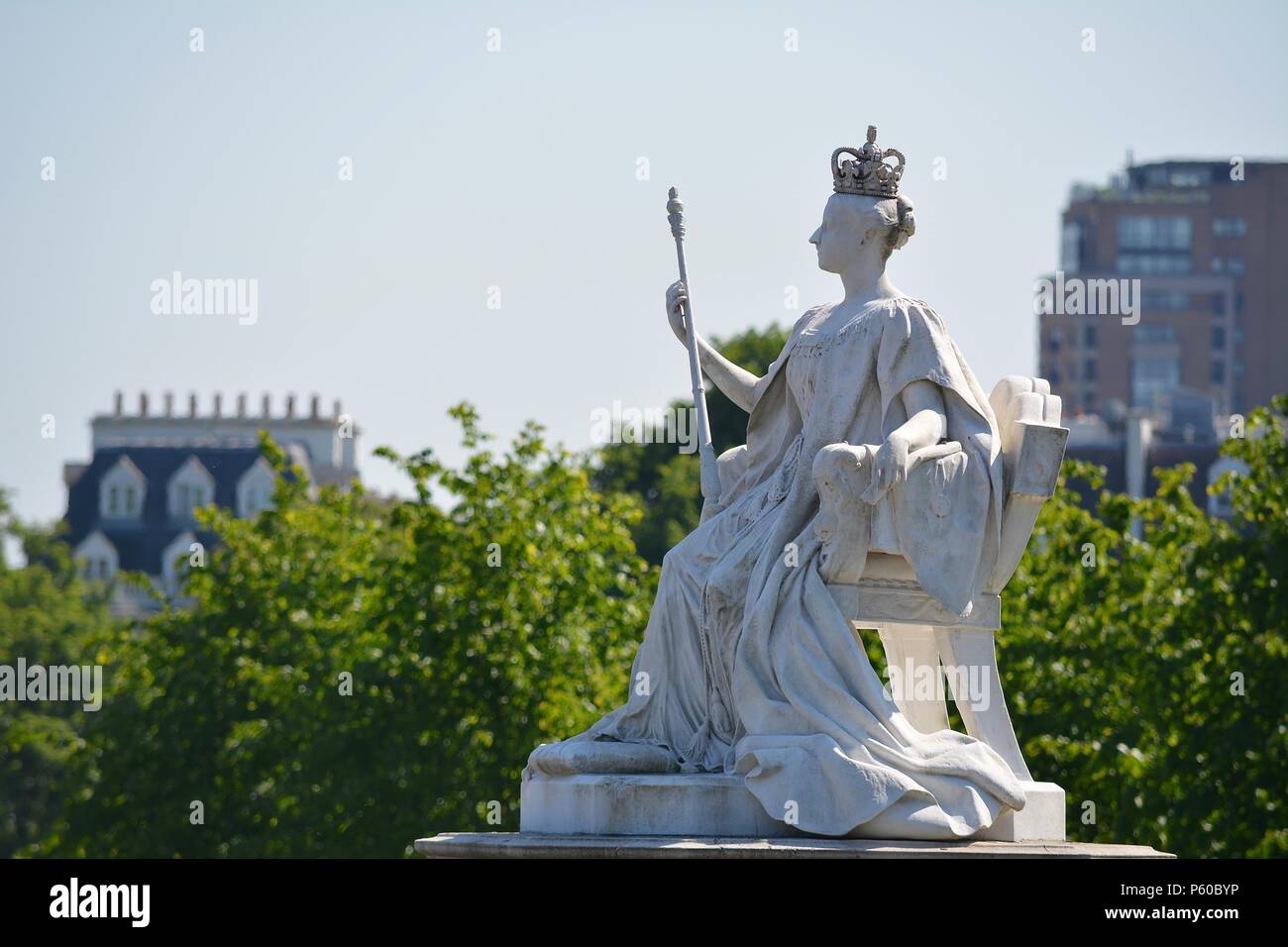 A statue of Queen Victoria in front of Kensington Palace in Kensington
