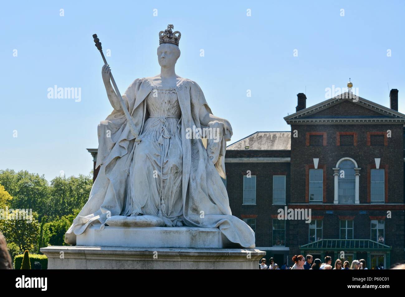 A statue of Queen Victoria in front of Kensington Palace in Kensington
