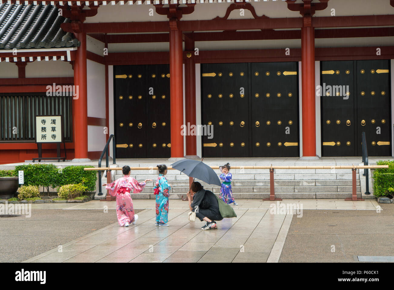 TOKYO, JAPAN - 23/5/2018: Traditionally dressed children posing for photography in front of old historic building in Asakusa, Tokyo. Stock Photo