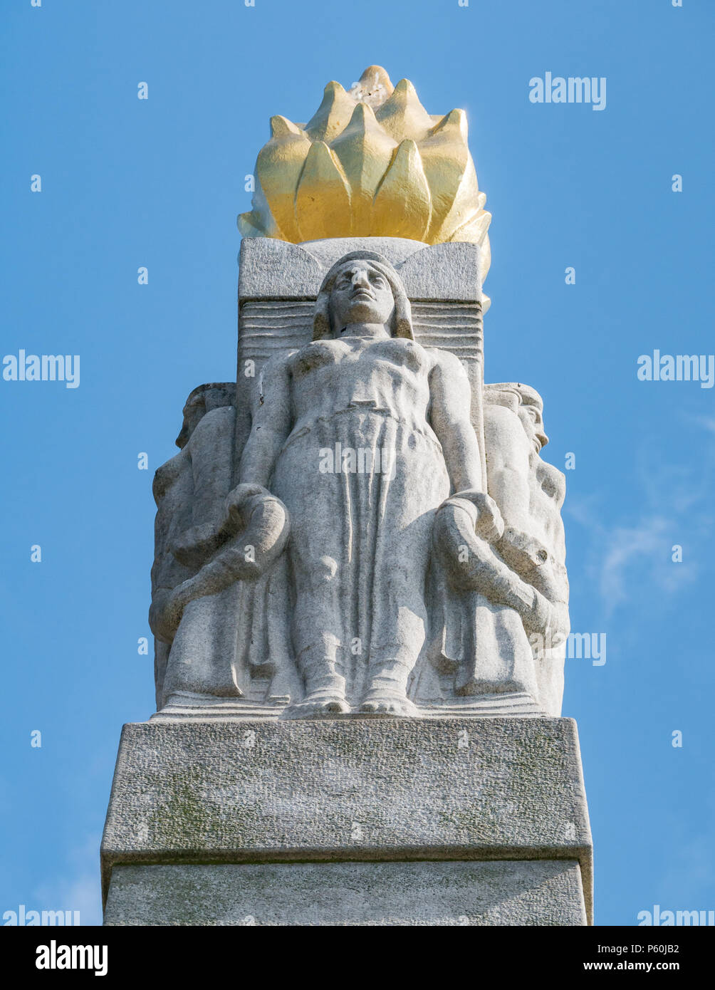 Detail of memorial to the Engine Room Heroes by Sir William Goscombe John with four maidens in flowing robes and a torch with a gold flame Stock Photo