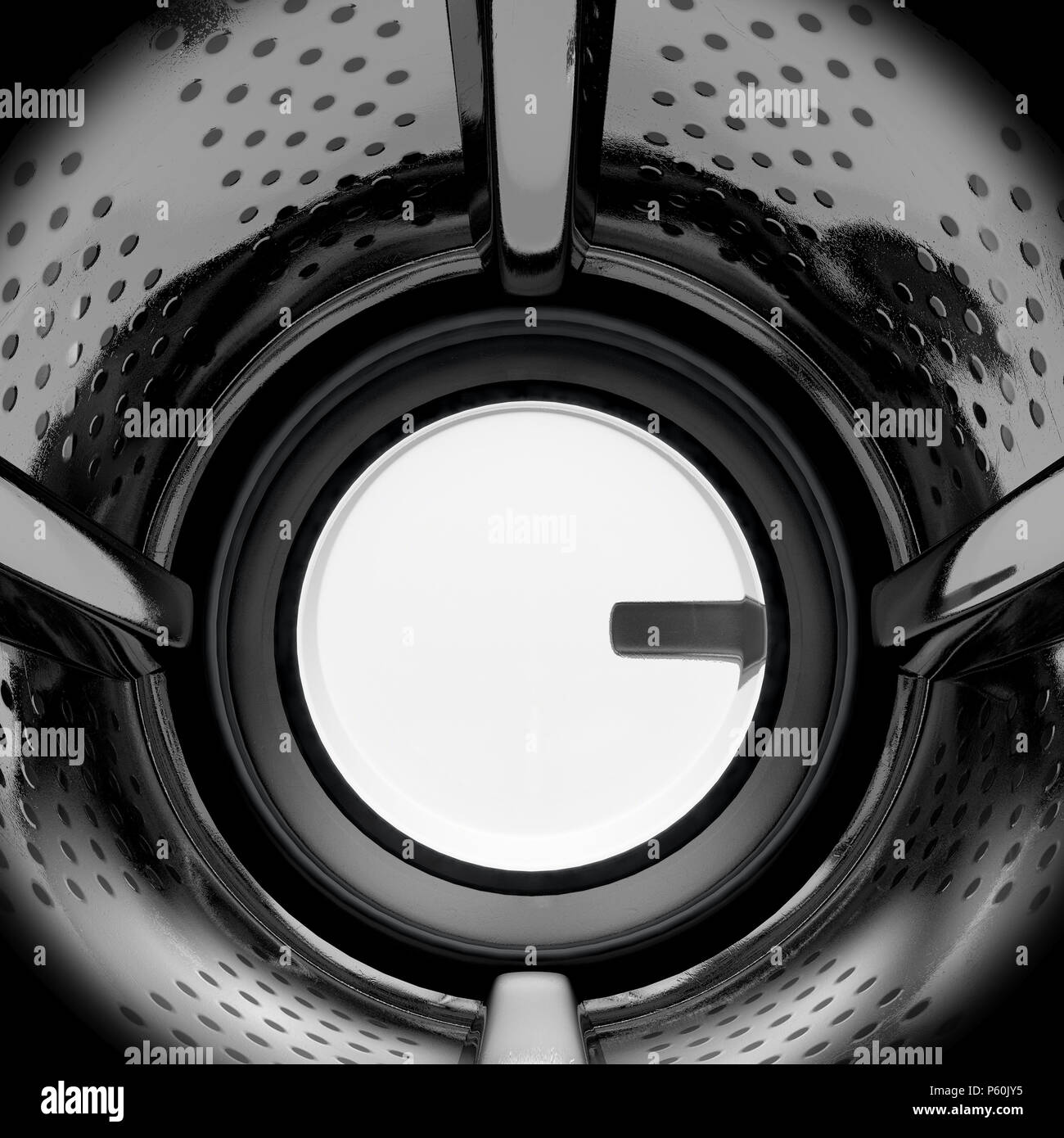 A closeup from the inside of the drum of an industrial washing machine