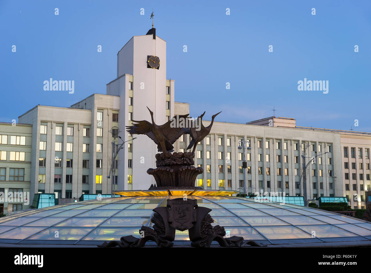 Minsk, Belarus. Famous Independence Square with beautiful sculpture of storks and the building of the Minsk Subway Administration Stock Photo