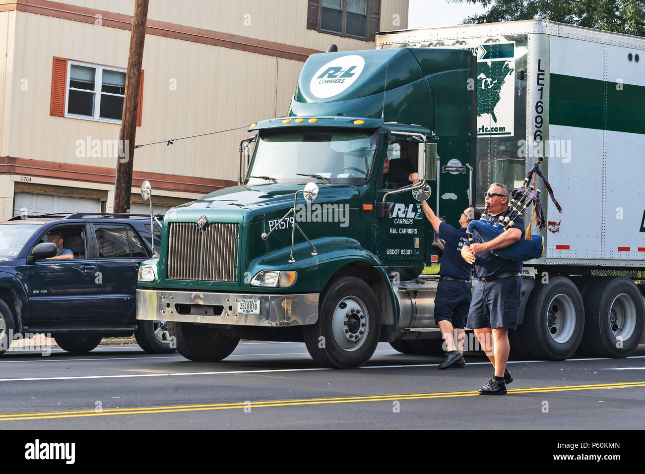 Frefighters of the local fire brigade collect donations in a boot