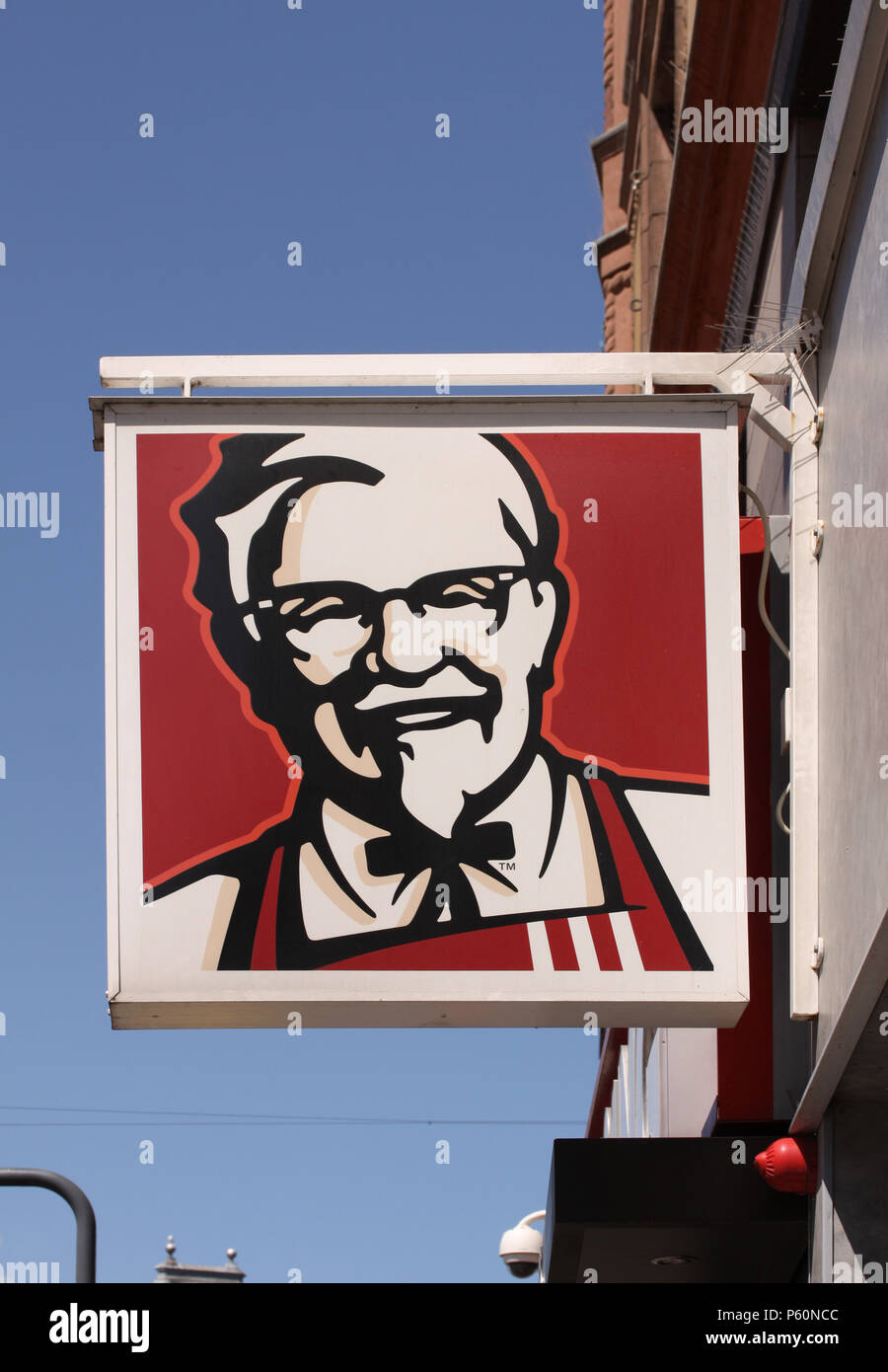 Copenhagen, Denmark - June 26, 2018: Kentucky Fried Chicken (KFC) Sign on building with blue sky background. KFC is a fast food restaurant chain that  Stock Photo