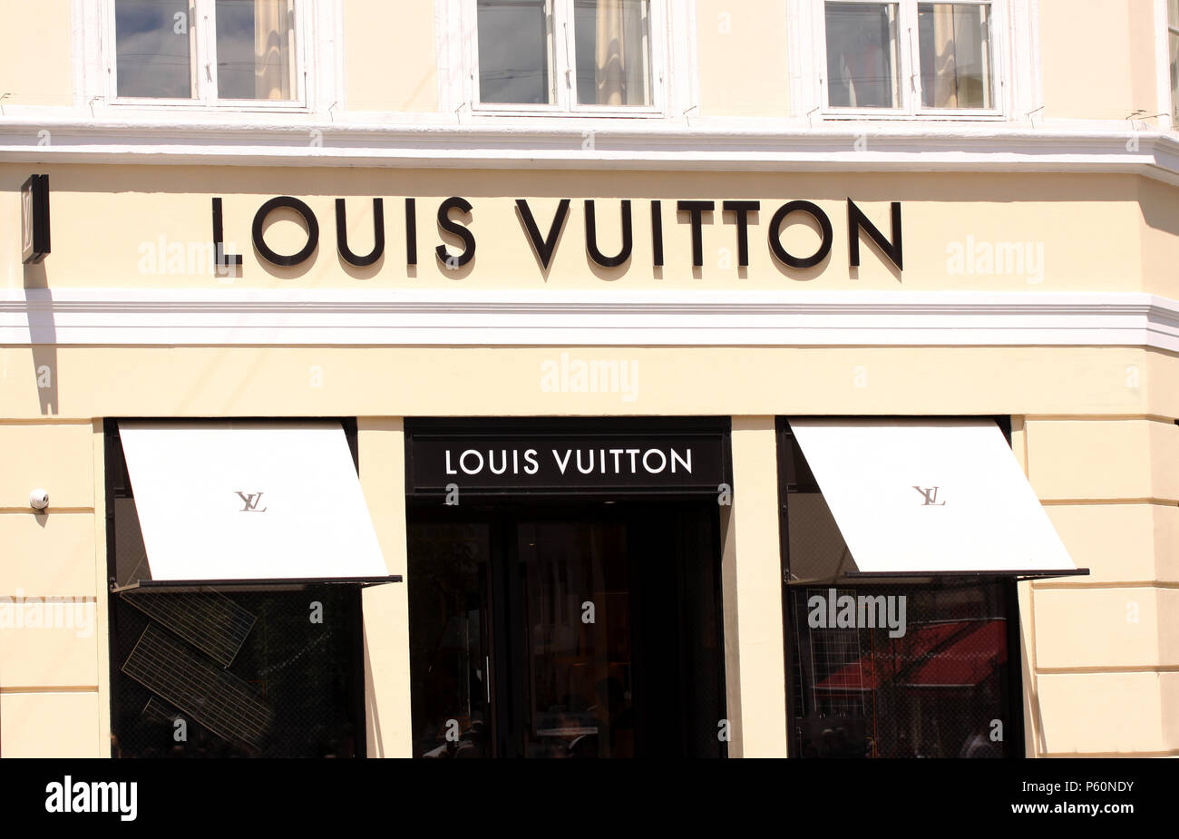 Copenhagen, Denmark - June 26, 2018: Louis Vuitton Logo sign panel on shop. Louis Vuitton is a famous high end fashion house manufacturer and luxury r Stock Photo