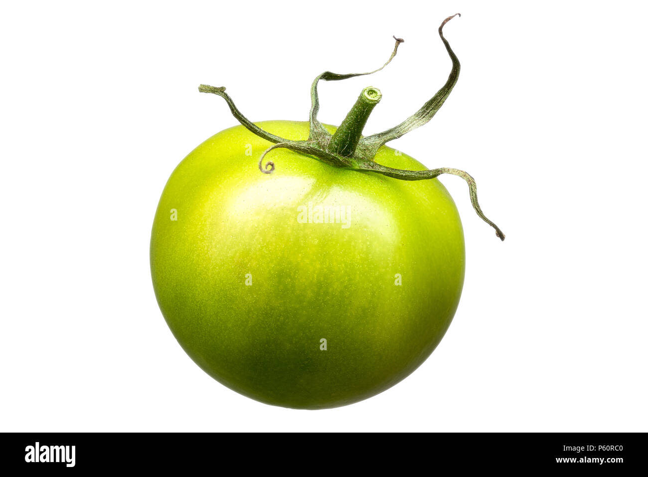 Single green tomato isolated on white background Stock Photo - Alamy