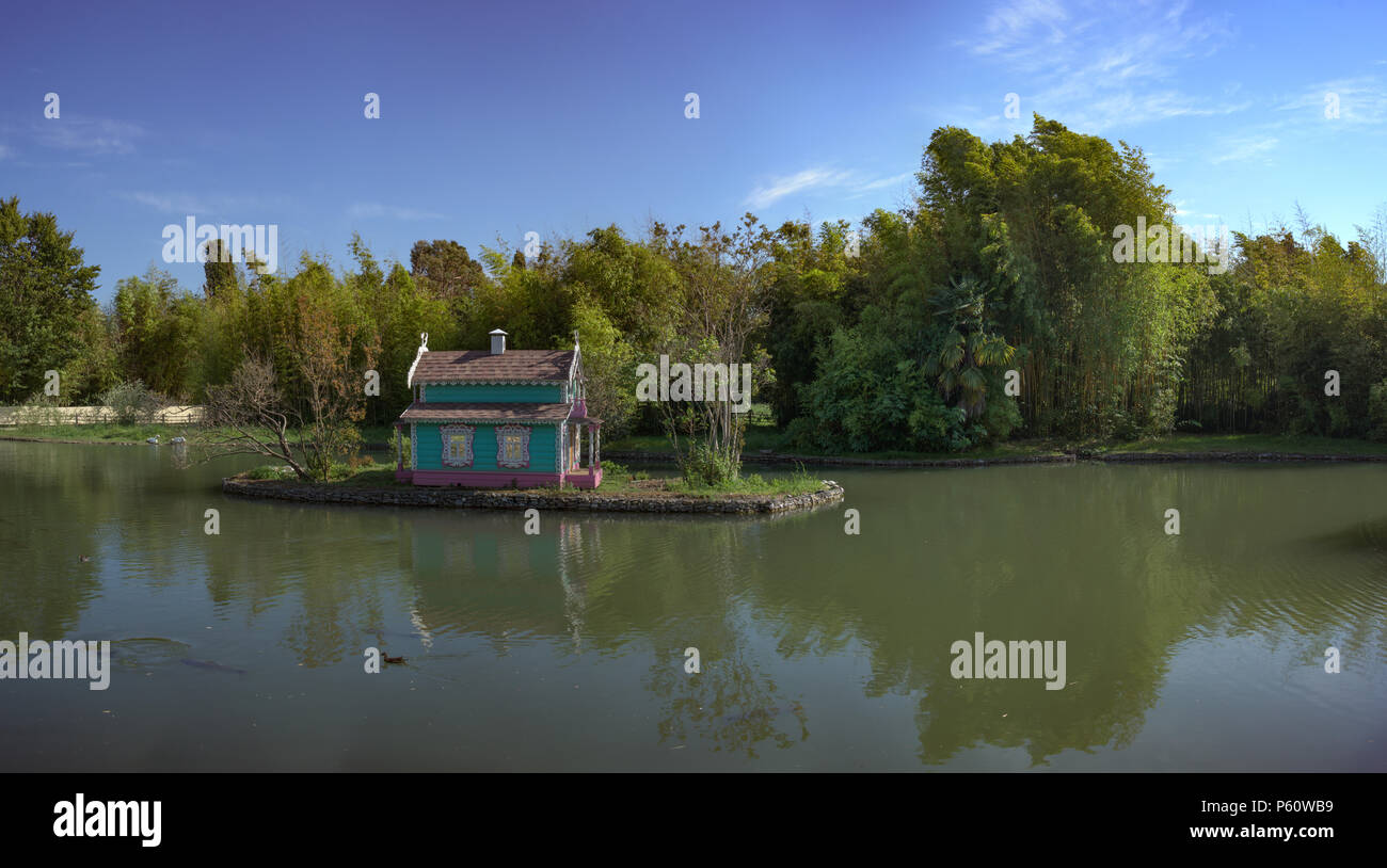 A large pond with an island in the middle and a house for birds. Sochi, Russia. Stock Photo