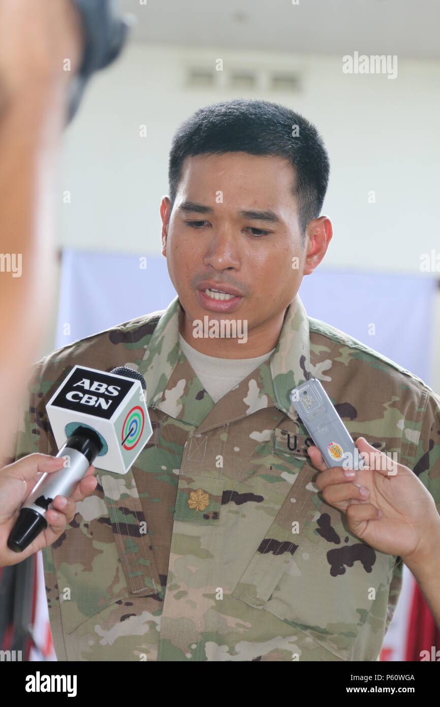 Major Alejandro L. Buniag, 303rd Maneuver Enhancement Brigade, 9th Mission Support Command, Combined Joint Civil Military Operation Task Force commander addresses the media following a press conference as part of the ceremony of Exercise Balikatan 2016 at Camp Peralta, Panay, Philippines, April 4, 2016. The ceremony signified the official start of the annual bilateral exercise that will run from 4-16 April. In Panay, Balikatan 2016 will consist of medical, dental, veterinary, and engineering civic actions, as part of humanitarian civic assistant projects. AFP and the U.S. military will work to Stock Photo