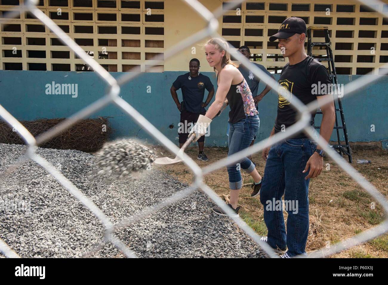 160402-N-MD297-052 VERACRUZ, Panama (April 2, 2016) Damage Controlman Fireman Apprentice Mikia Bollinger, assigned to the Arleigh Burke-class guided-missile destroyer USS Lassen (DDG 82) shovels gravel at the Cosecha de Amistad School in Veracruz, Panama during a community service event with members of PanamaÕs Presidential Protective Service (SPI). Lassen is currently underway in support of Operation Martillo, a joint operation with the U.S. Coast Guard and partner nations within the 4th Fleet area of responsibility. Operation Martillo is being led by Joint Interagency Task Force South, in su Stock Photo