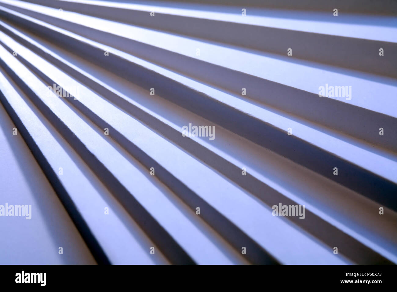 Way up concept. Staircase made from paper under beam of light Stock Photo