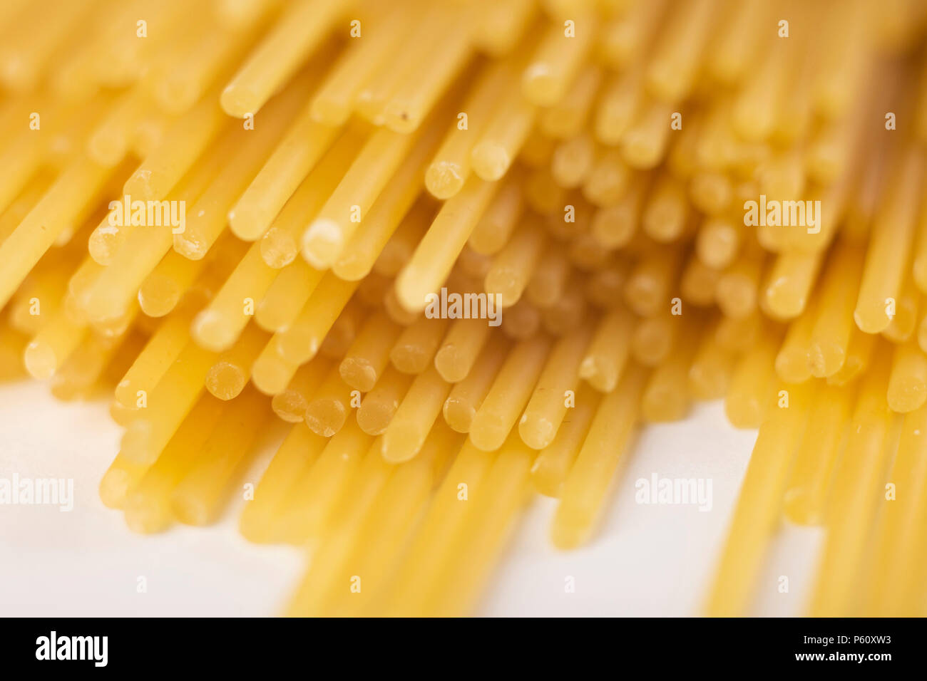 spaghetti tied with a brown thread. On a white background Stock Photo ...
