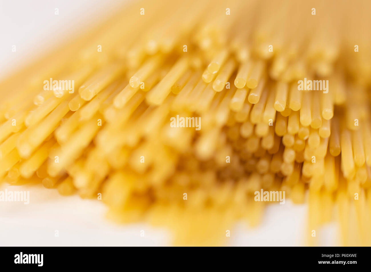 spaghetti tied with a brown thread. On a white background Stock Photo ...