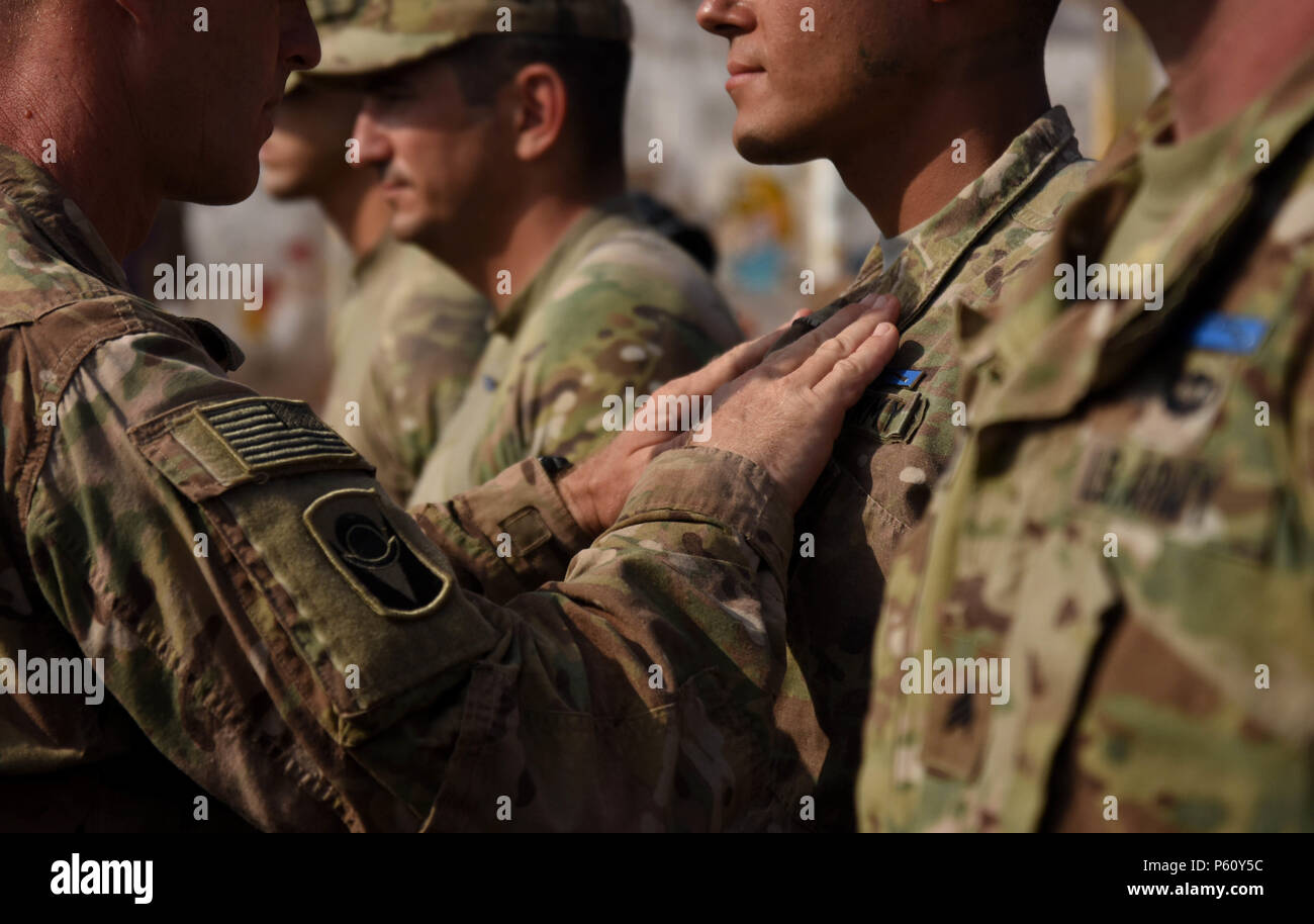U.s. Army Cadres Pin Badges On Soldiers During An Expert Infantry Badge  Pinning Ceremony April 1, 2016, At Arta, Djibouti. The Eib Signifies The  Most Skilled Infantry Members, Proving Themselves Masters Of