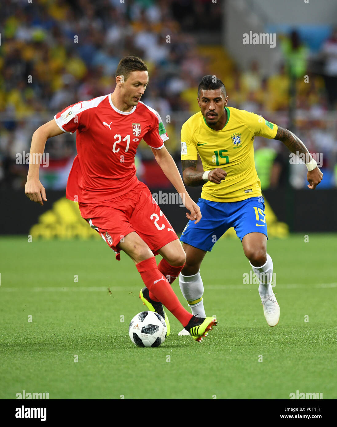 Moscow, Russia. 27th June, 2018. Paulinho (R) of Brazil vies with Nemanja Matic of Serbia during the 2018 FIFA World Cup Group E match between Brazil and Serbia in Moscow, Russia, June 27, 2018. Credit: Du Yu/Xinhua/Alamy Live News Stock Photo