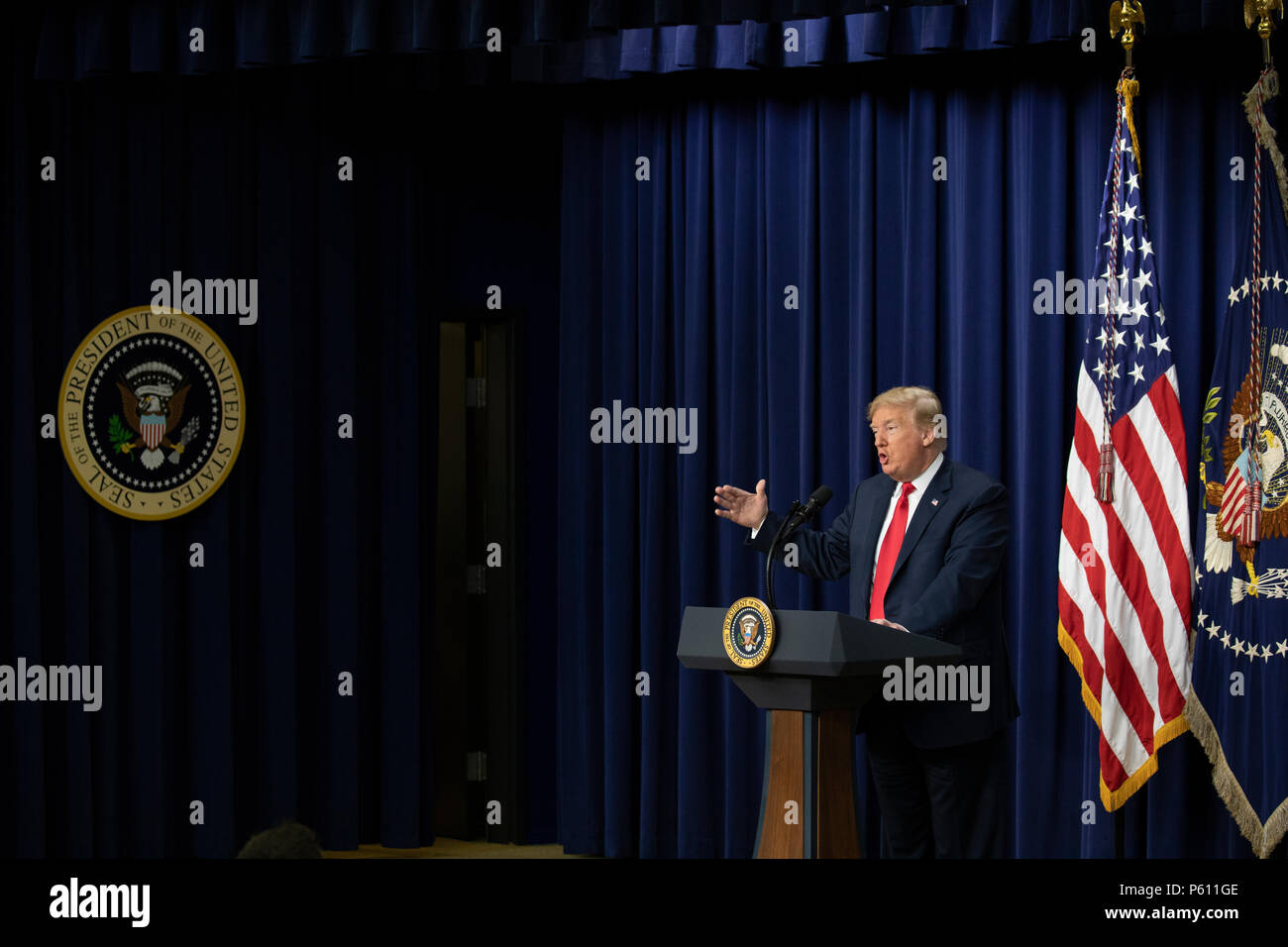 United States President Donald Trump delivers remarks to a group of ...