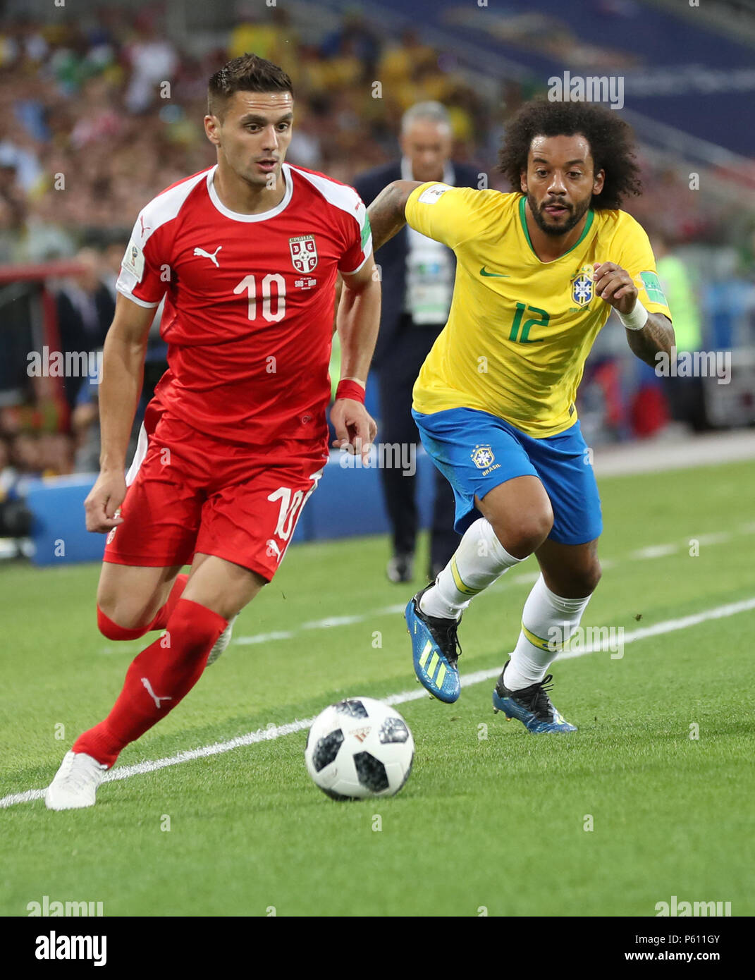 Moscow, Russia. 27th June, 2018. Marcelo (R) of Brazil vies with Dusan Tadic of Serbia during the 2018 FIFA World Cup Group E match between Brazil and Serbia in Moscow, Russia, June 27, 2018. Credit: Xu Zijian/Xinhua/Alamy Live News Stock Photo