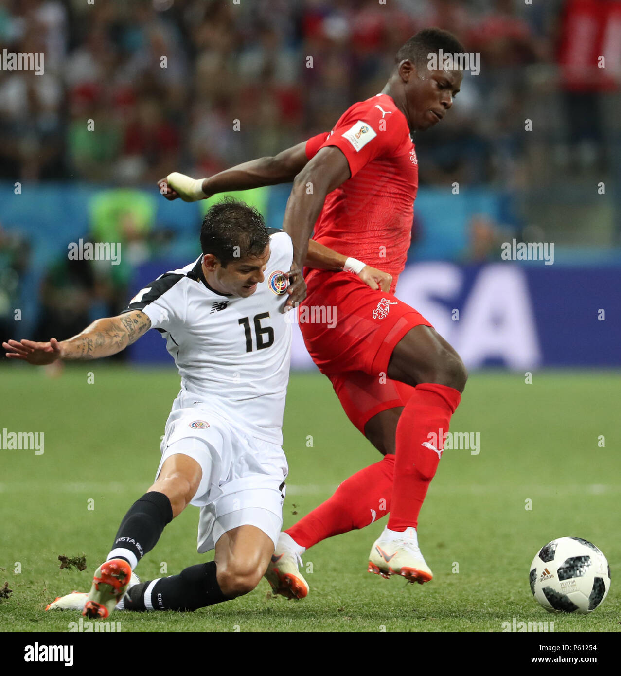 Nizhny Novgorod, Russia. 27th June, 2018. Breel Embolo (R) of Switzerland vies with Cristian Gamboa of Costa Rica during the 2018 FIFA World Cup Group E match between Switzerland and Costa Rica in Nizhny Novgorod, Russia, June 27, 2018. Credit: Ye Pingfan/Xinhua/Alamy Live News Stock Photo