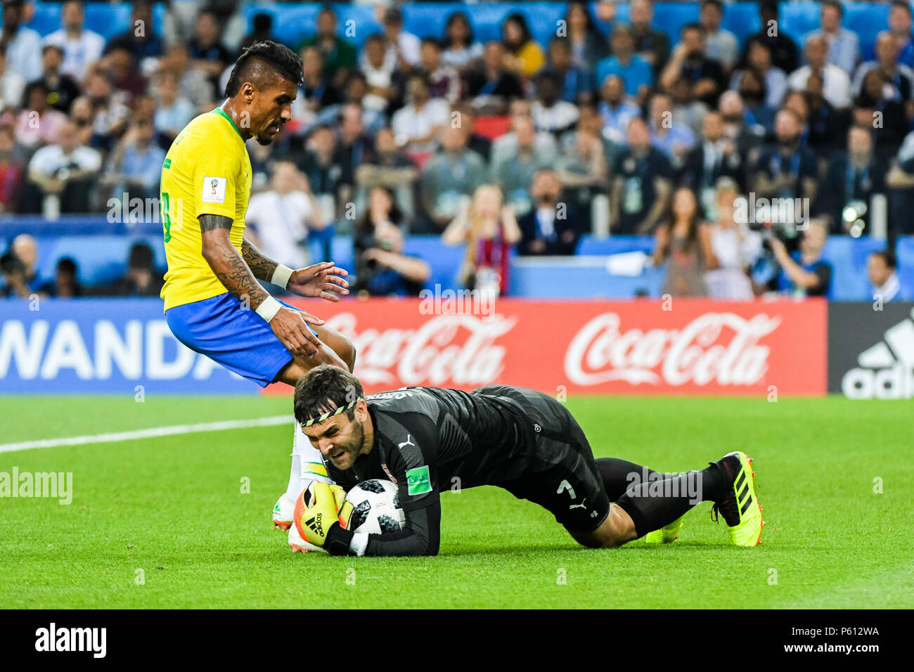 Spartak Stadium, Moscow, Russia. 27th June, 2018. FIFA World Cup Football, Group E, Serbia versus Brazil; Vladimir Stojkovic of Serbia dives to save the ball the in front of Paulinho of Brazil Credit: Action Plus Sports/Alamy Live News Stock Photo