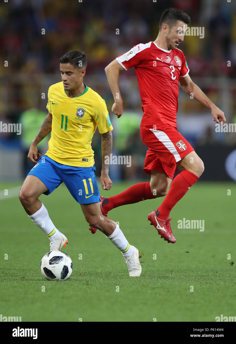 Moscow, Russia. 27th June, 2018. Philippe Coutinho (L) of Brazil vies with Antonio Rukavina of Serbia during the 2018 FIFA World Cup Group E match between Serbia and Brazil in Moscow, Russia, June 27, 2018. Brazil won 2-0 and advanced to the round of 16. Credit: Xu Zijian/Xinhua/Alamy Live News Stock Photo