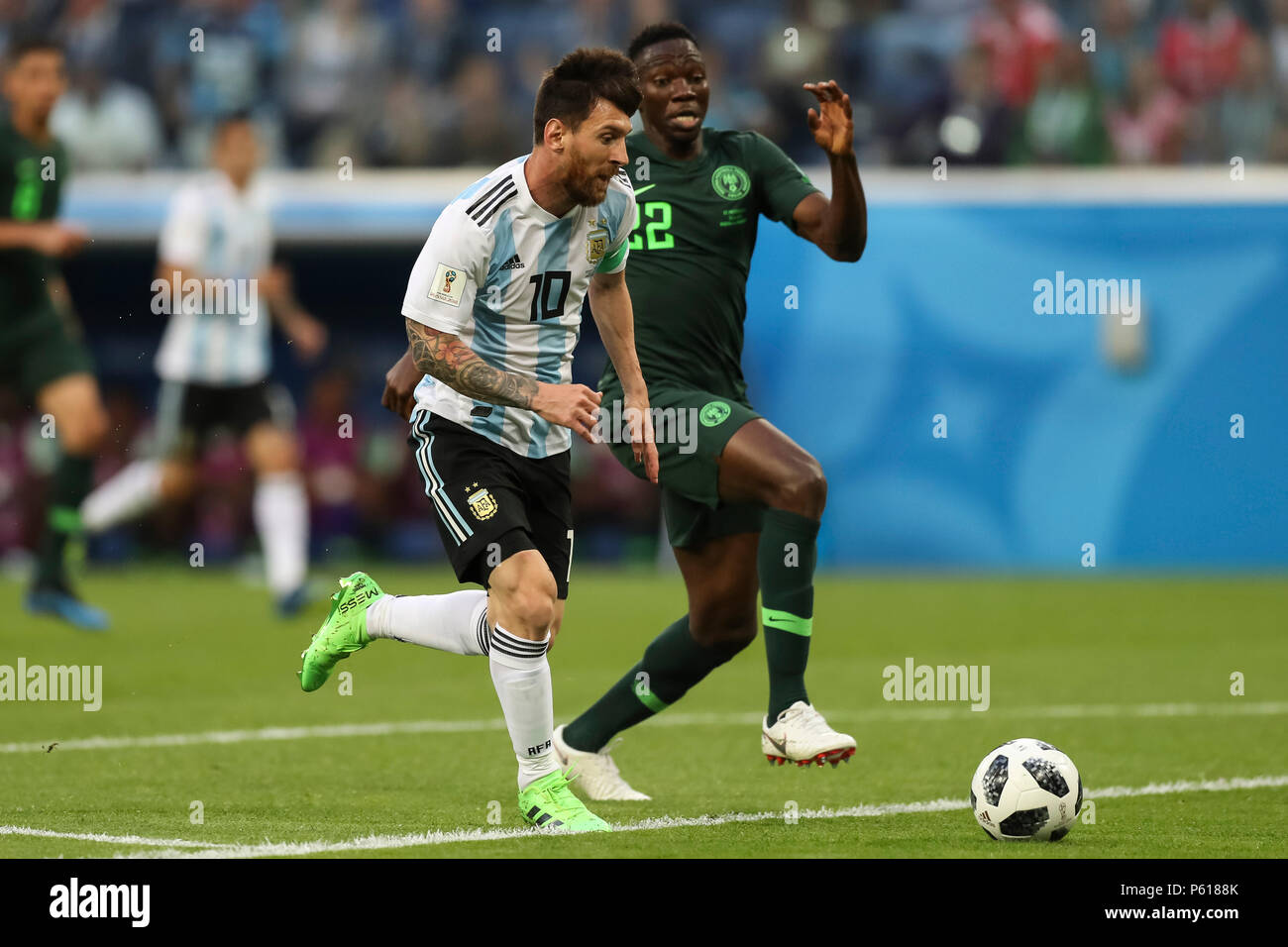 St Petersburg, Russia. 26th Jun, 2018. Lionel Messi of Argentina breaks through past Kenneth Omeruo of Nigeria to score his side's first goal to make the score 1-0 during the 2018 FIFA World Cup Group D match between Nigeria and Argentina at Saint Petersburg Stadium on June 26th 2018 in Saint Petersburg, Russia. (Photo by Daniel Chesterton/phcimages.com) Credit: PHC Images/Alamy Live News Stock Photo