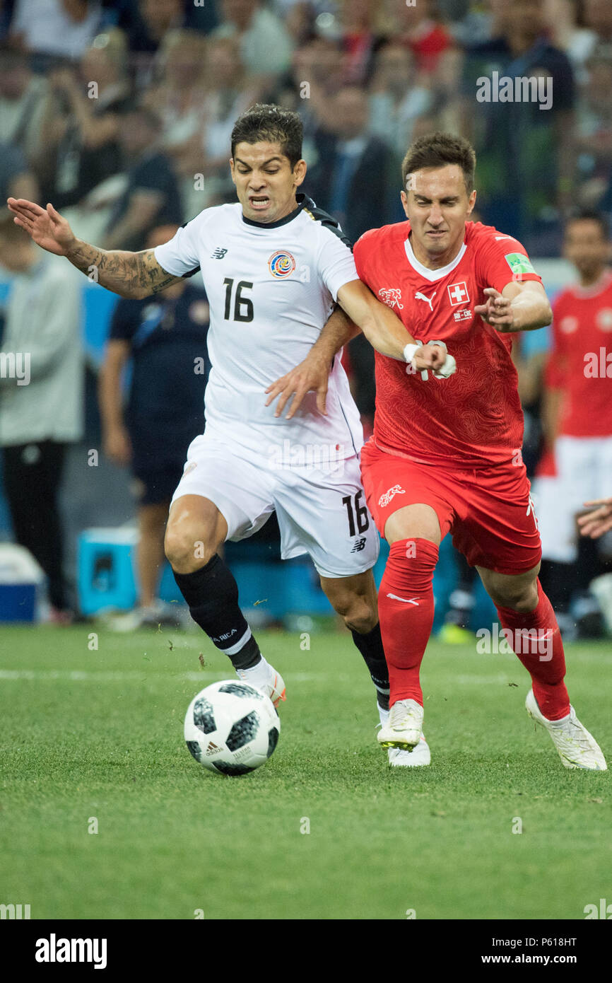 Cristian GAMBOA (left, CRC) versus Mario GAVRANOVIC (SUI), action, duels, portrait, Switzerland (SUI) - Costa Rica (CRC) 2: 2, preliminary round, group E, match 43, on 27.06.2018 in Nischni Novgorod; Football World Cup 2018 in Russia from 14.06. - 15.07.2018. | usage worldwide Stock Photo
