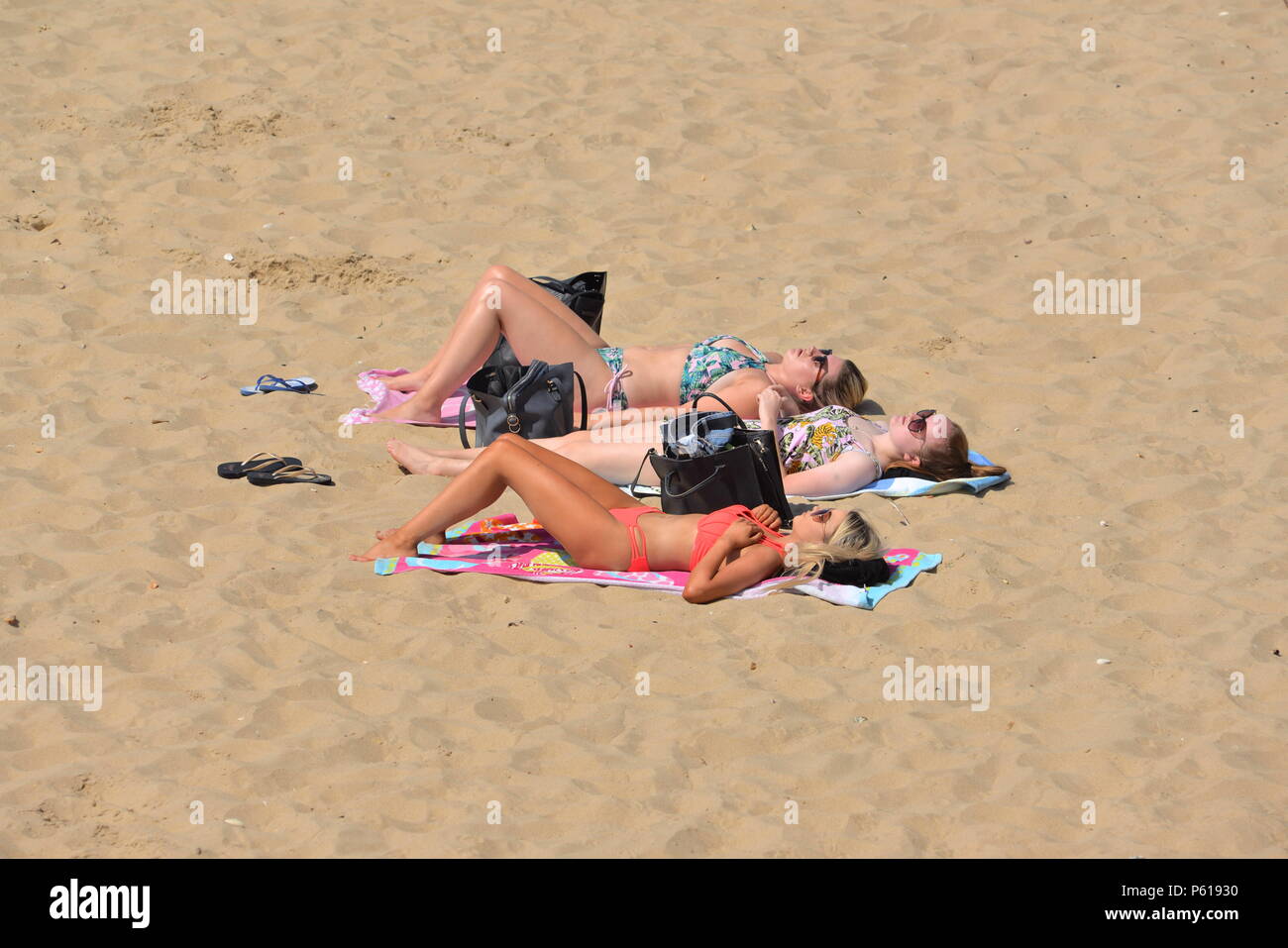 Girls sunbathing in bikinis hires stock photography and images Alamy