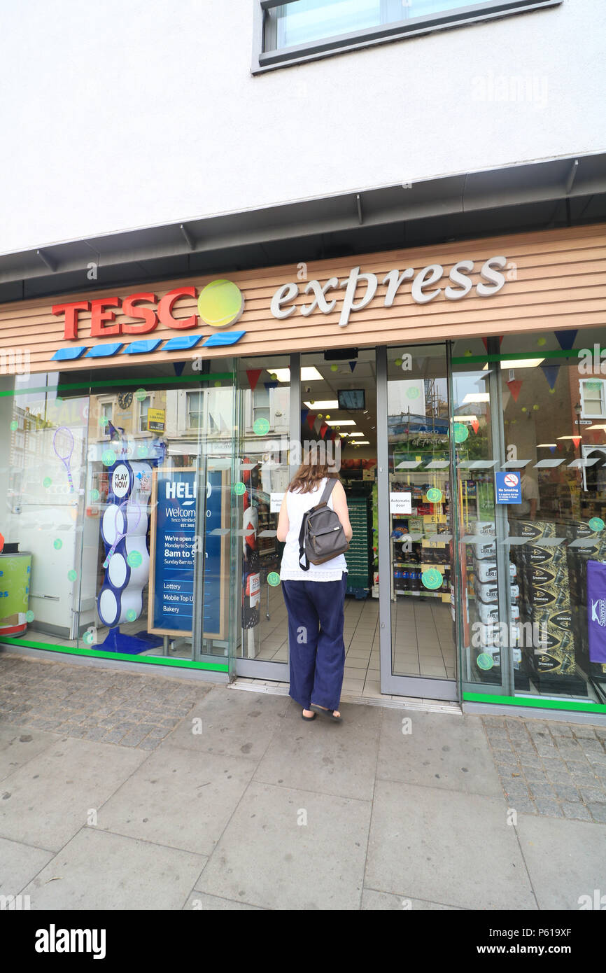 London UK. 28th June 2018. Wimbledon: A branch of Tesco Express store in  Wimbledon replaces its logo with a tennis ball for the Wimbledon tennis  championships which starts on July 2 Credit: