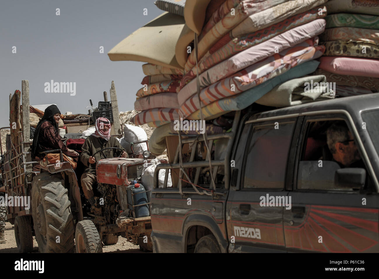 Syrian refugees leave their camp in the border village Arsal, east ...