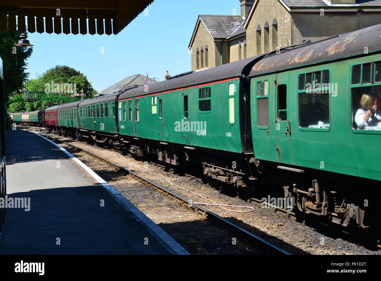 Steam train pulling passenger coaches hires stock photography and