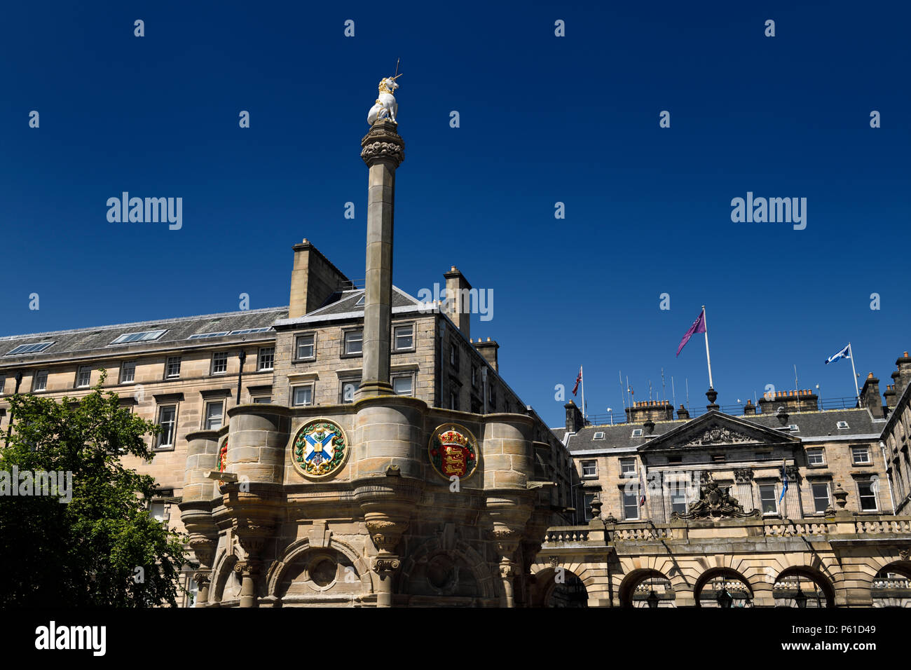 Mercat Cross with Royal Unicorn and heraldic medalions in Old Town of Edinburgh in Parliament Square on Royal Mile Scotland United Kingdom Stock Photo