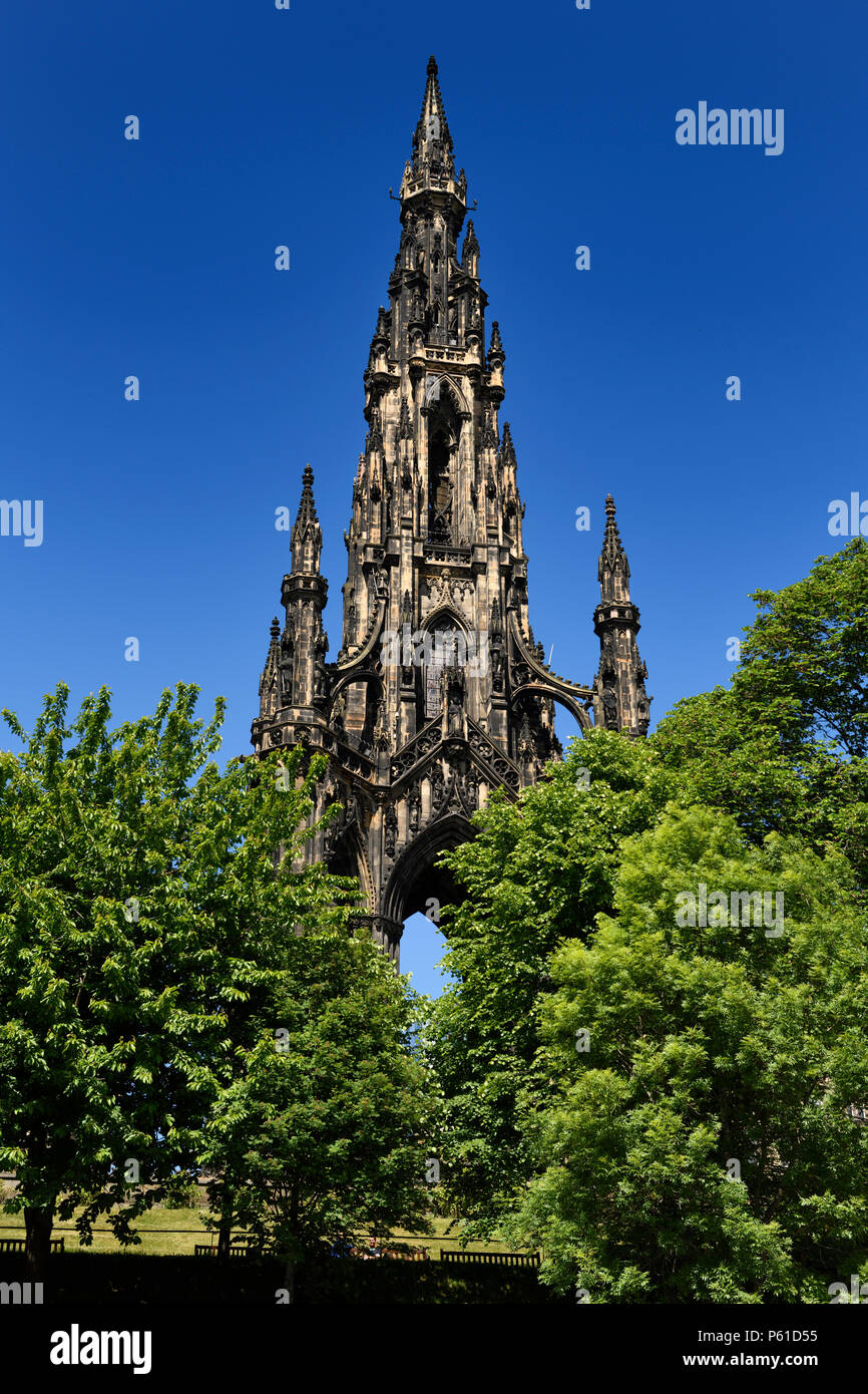 Victorian Gothic architecture of Scott Monument in Princes Street Gardens Edinburgh Scotland UK with blue sky Stock Photo