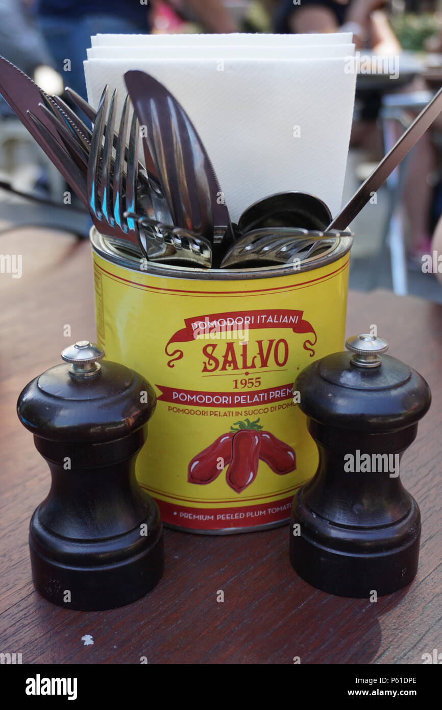 cutlery in a tomato sauce can with salt and pepper Stock Photo