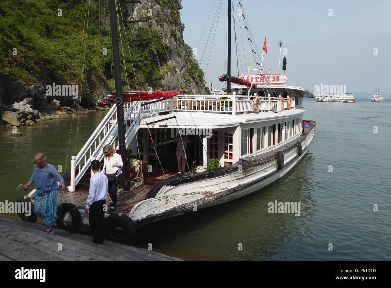 Tourist boat at the landing stage, Dao Go Island, Ha Long Bay, Quảng