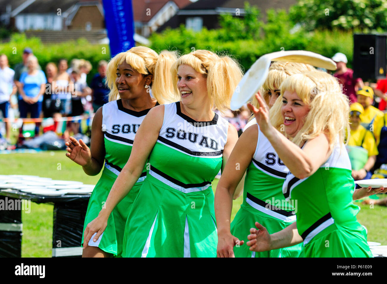 The Katie Creams team of four young women in cheerleader costume and