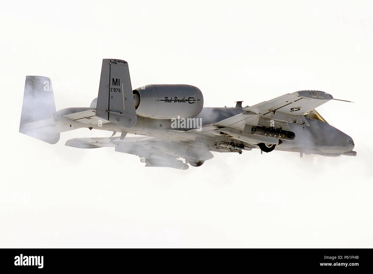 An A-10 Thunderbolt II engages in training mission at the Grayling Aerial Gunnery Range near Waters, Mich., April 7, 2016. The A-10 is operated by the 107th Fighter Squadron of the Michigan Air National Guard and are based at Selfridge Air National Guard Base, Mich. (U.S. Air National Guard photo by Master Sgt. David Kujawa) Stock Photo