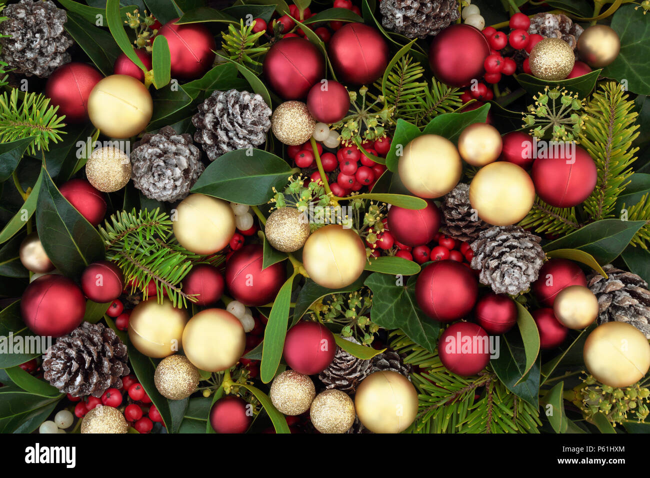 Christmas decorative background border on parchment paper with red bauble  decorations, holly, mistletoe, ivy, fir and pine cones Stock Photo - Alamy