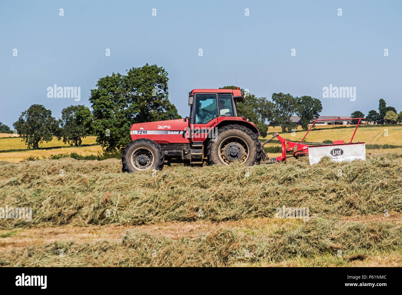 Farming in England with a Big Red Tractor Stock Photo Alamy