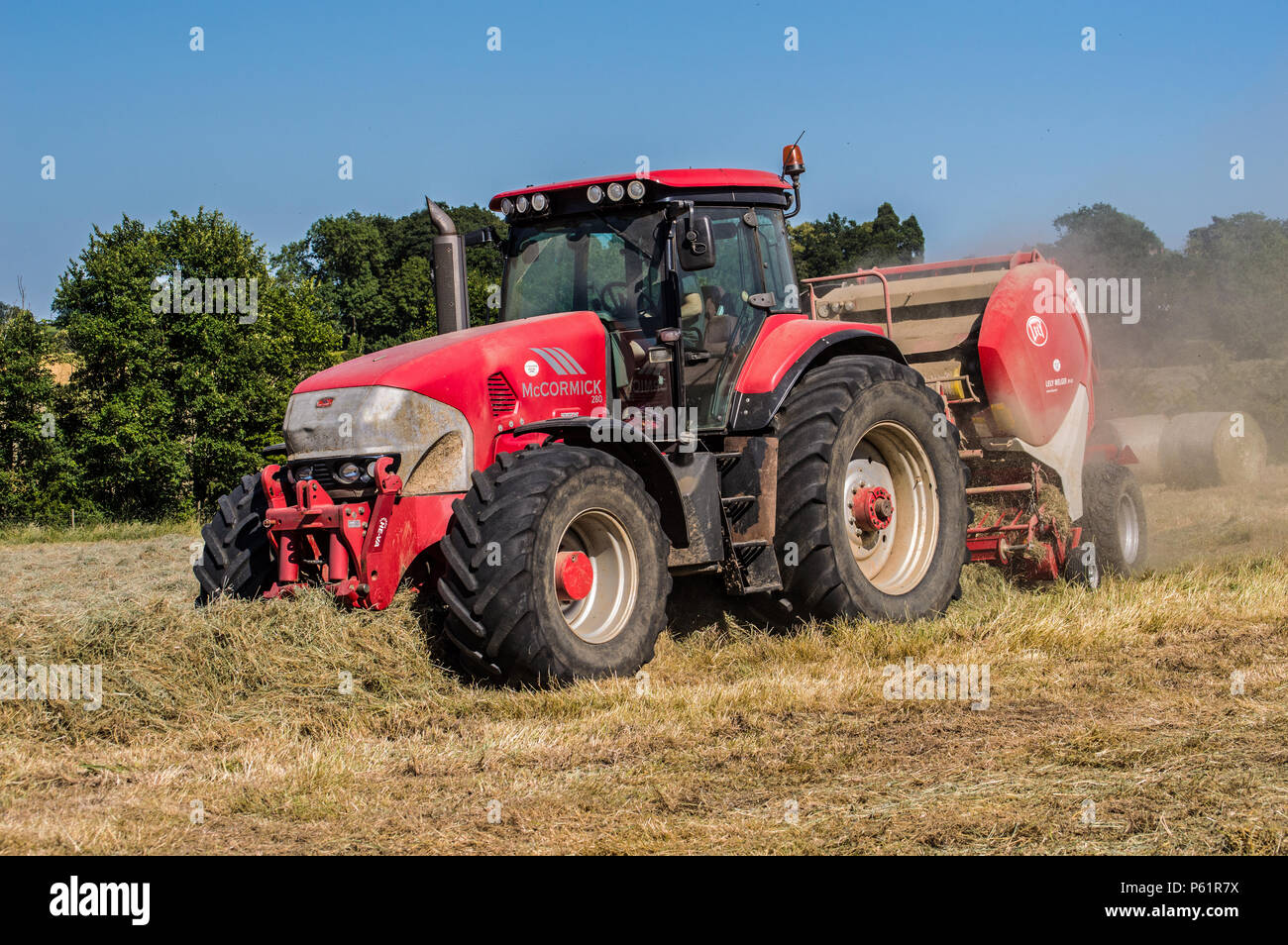 Farming in England with a Big Red Tractor Stock Photo Alamy