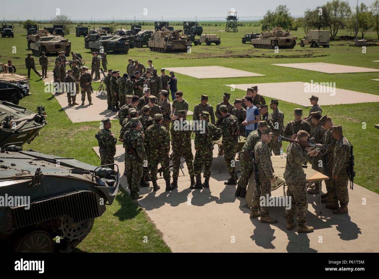 U.S. Marines with Black Sea Rotational Force and Romanian soldiers with the 911th Infantry Battalion and 912th Tank Battalion explain the  multiple weapon systems and military equipment during Platinum Lynx 16-4 aboard Babadag Training Area, Romania April 17, 2016. During Platinum Lynx 16-4, Allies from the United States and Romania will conduct company-level tactics in order to develop proficiency in fire and maneuver. (U.S. Marine Corps photo by Cpl. Tyler Andersen/Released) Stock Photo