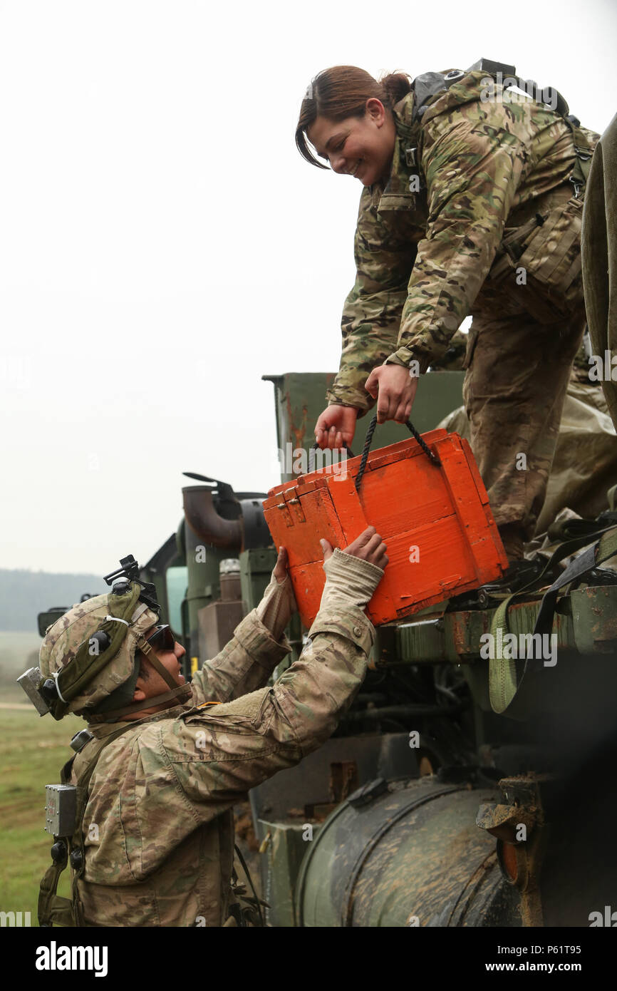 U.S. Soldiers of 1st Squadron, 91st Cavalry Regiment, 173rd Airborne Brigade unload equipment while conducting a resupply mission during exercise Saber Junction 16 at the U.S. Army’s Joint Multinational Readiness Center (JMRC) in Hohenfels, Germany, April 15, 2016. Saber Junction 16 is the U.S. Army Europe’s 173rd Airborne Brigade’s combat training center certification exercise, taking place at the JMRC in Hohenfels, Germany, Mar. 31-Apr. 24, 2016.  The exercise is designed to evaluate the readiness of the Army’s Europe-based combat brigades to conduct unified land operations and promote inter Stock Photo