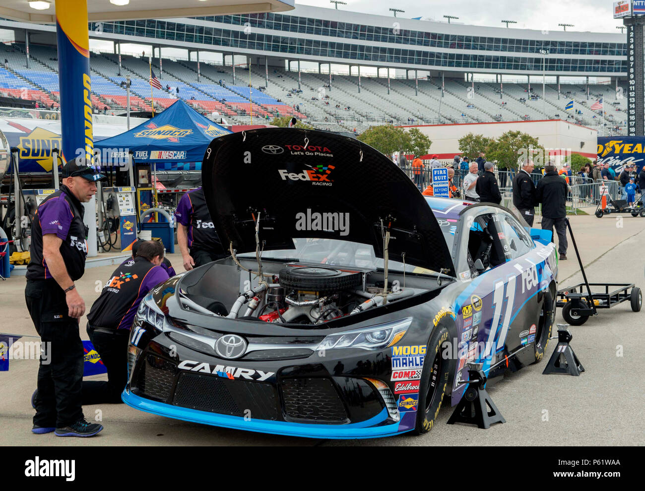 The number 11 car, driven by Denny Hamlin, is given a pre-race inspection April 9, 2016, at the Texas Motor Speedway, Fort Worth, Texas. U.S. Air Force Gen. David L. Goldfein, United States Air Force vice chief of staff attended the race to administer the oath of enlistment to a group of fourteen men and women in the Air Force Delayed Entry Program. (U.S. Air Force photo by Airman 1st Class Austin Mayfield/Released) Stock Photo