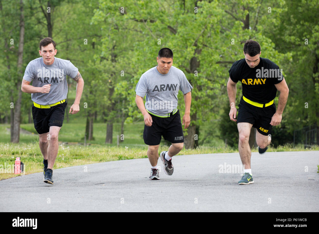 U.S. Army Spc. Jason Green, Sgt. James Ahn, and Staff Sgt. Jesse Harris, assigned to the 49th Ordnance Company (EOD), 184th Ordnance Battalion (EOD), start the 2-mile run event of the Army Physical Fitness Test (APFT) at the beginning of the 52nd and 111th Ordnance Group (EOD) Team of the Year 2016 at the Wendell H. Ford Regional Training Center, Greenville, Ky., April 25, 2016. The weeklong competition tests teams, consisting of (2 to 3) EOD technicians, in various scenarios they may encounter in situations around the world, to determine the most physically, mentally, tactically, and technica Stock Photo