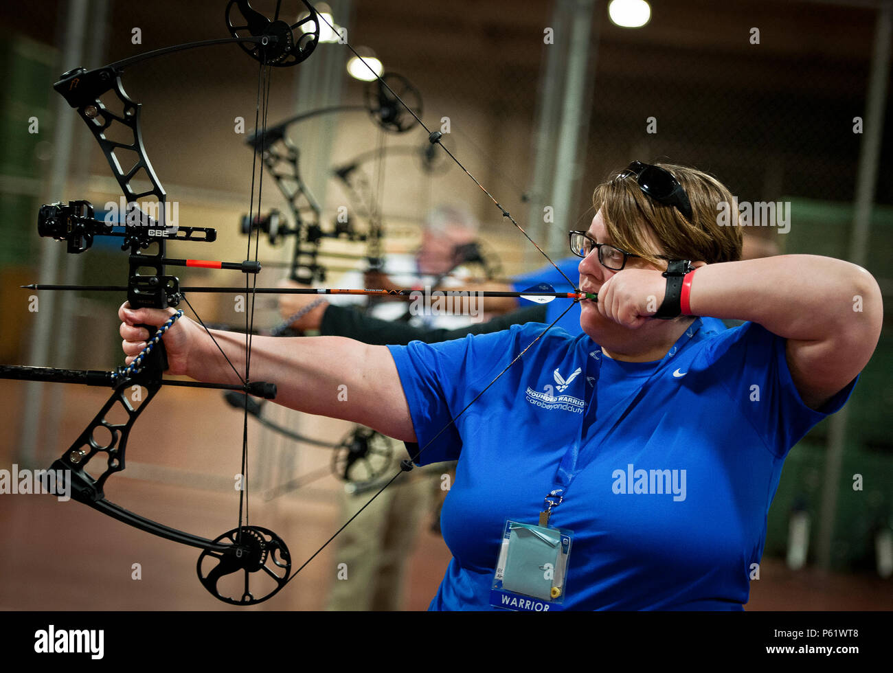 Cynthia Moss, a Warrior Care attendee, lines up her shot during a
