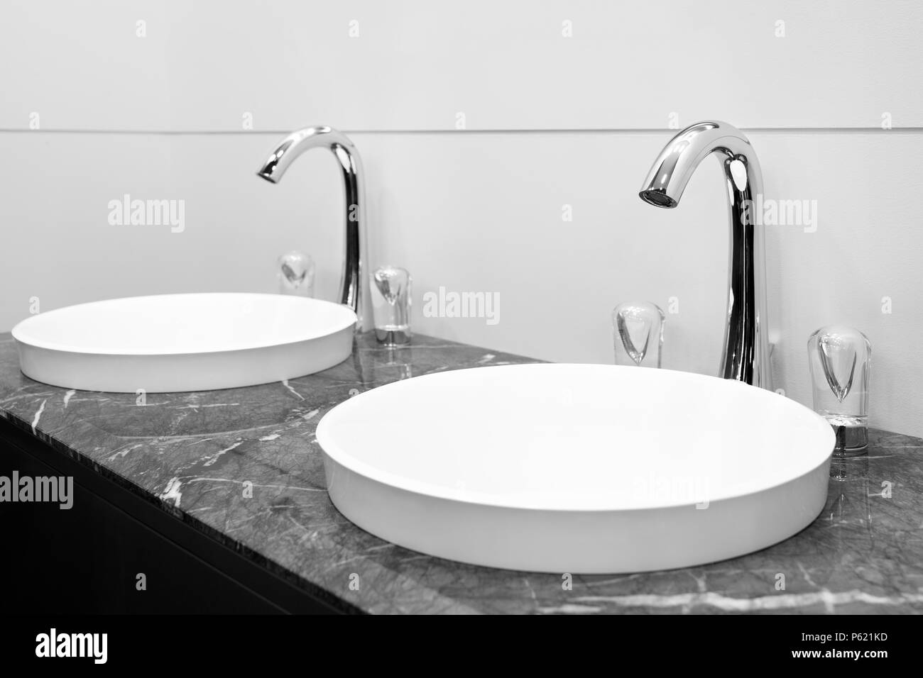 Bathroom black and white interior with two sink and faucet Stock Photo