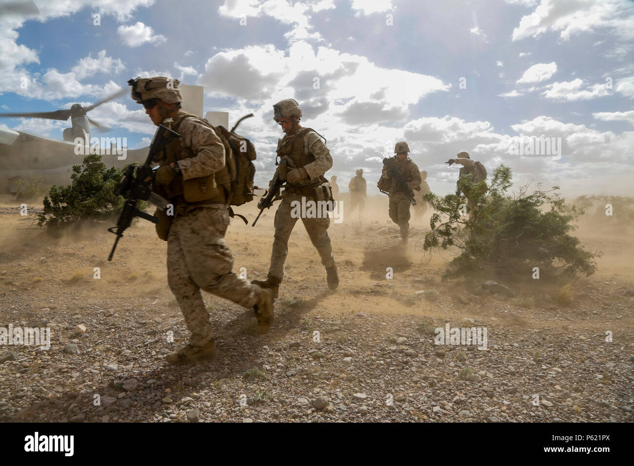 U.S. Marines with 1st Platoon, India Company, 3rd Battalion, 6th Marine Regiment, 2nd Marine Division, II Marine Expeditionary Force push out during a Marine Expeditionary Unit exercise at East Tact Airfield Ariz., April 8, 2016.  Weapons and Tactics Instructor (WTI) course 2-16 is a seven week training event hosted by Marine Aviation Weapons and Tactics Squadron One (MAWTS-1) cadre, which emphasizes operational integration of the six functions of the Marine Corps aviation in support of a Marine Air Ground Task Force. MAWTS-1 provides standardized advanced tactical training and certification o Stock Photo